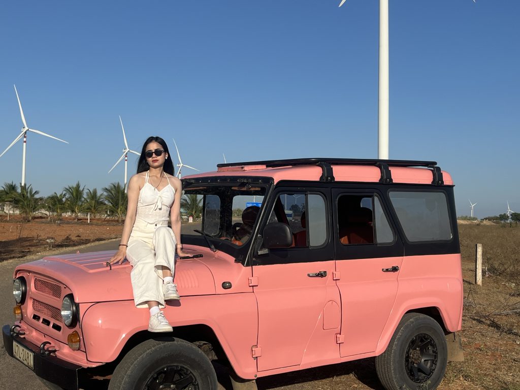 Visitors enjoying a Mui Ne Jeep Tour at Wind Turbines Mui Ne