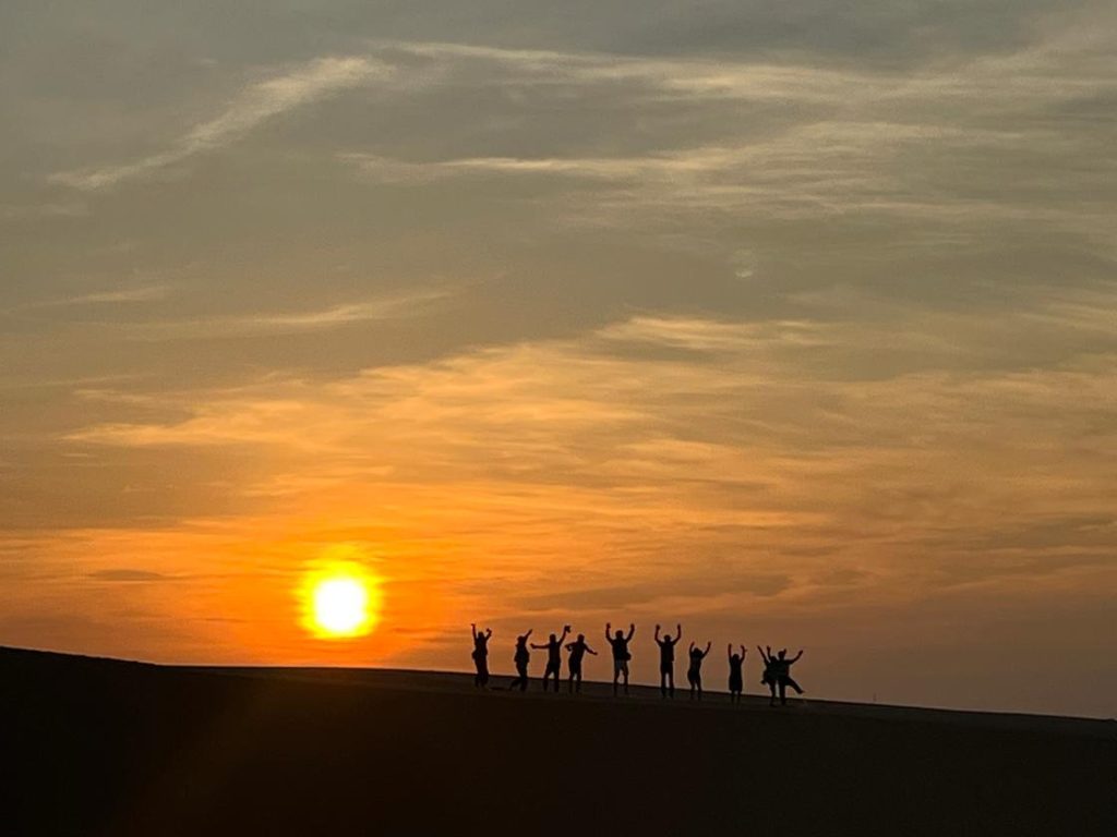 Visitors taking photos at White Sand Dunes Mui Ne